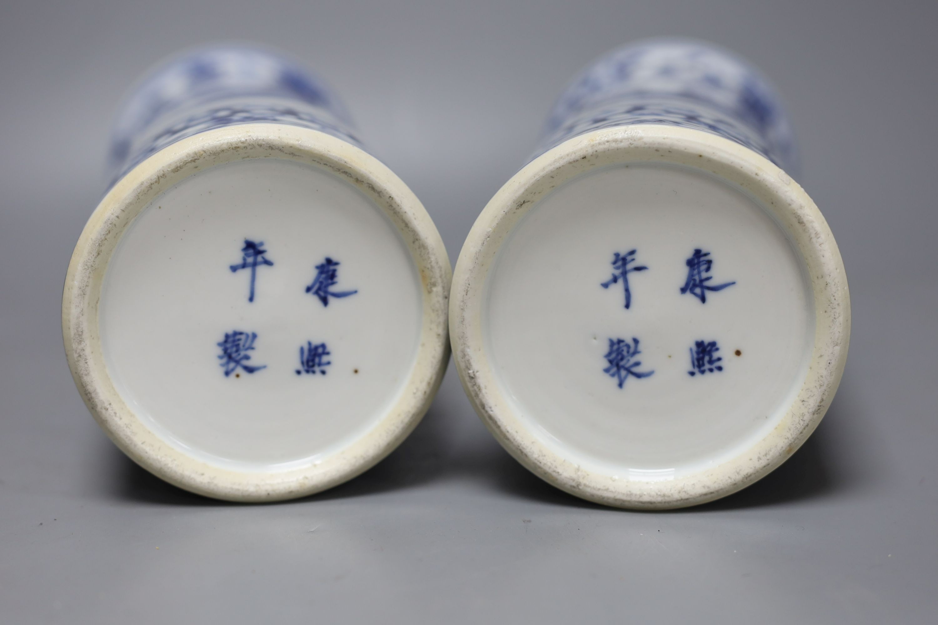 A pair of Chinese blue and white sleeve vases, late 19th century, 31cm